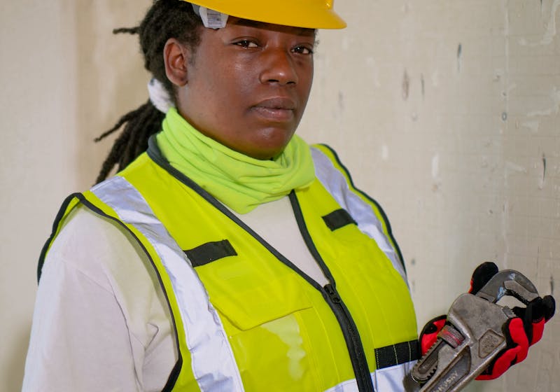 Professional plumber inspecting pipes for leaks with advanced diagnostic tools